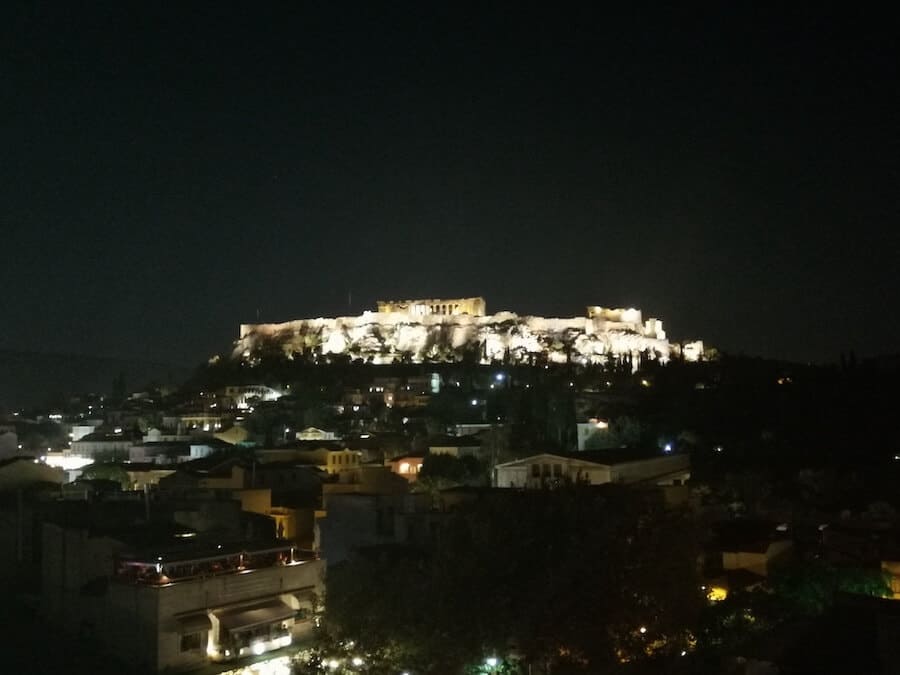 The view of the Acropolis from the rooftop bar at Pella Inn Hostel in Athens Greece, one of the best hostels in Europe