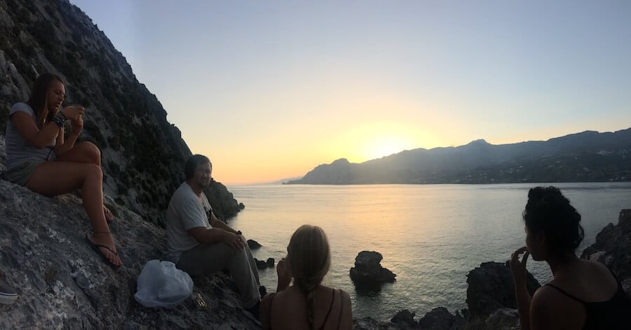 Sunset view with a group of hostel from nearby Youth Hostel Plakias in Crete, Greece - one of the best hostels in Greece