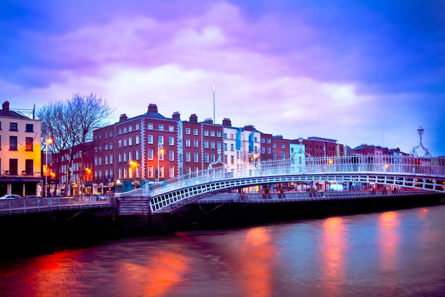 Dublin Ireland at dusk with waterfront and Ha'penny Bridge