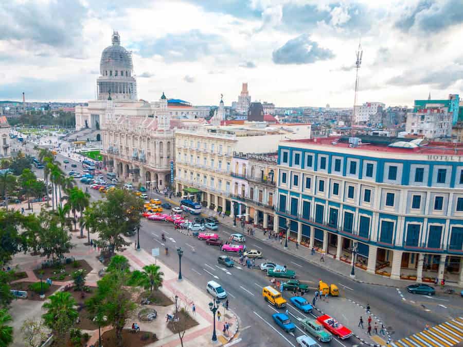 View of Havana's Parque Central from Top, overlooking a street with classic cars and the Capitol Building