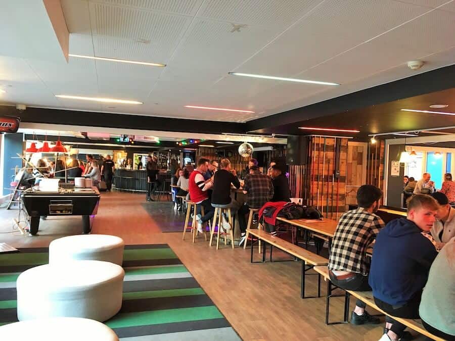 Travelers socializing in the common area at Generator Copenhagen