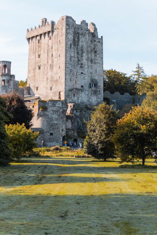 A grassy area in front of Blarney Castle, one of the best day trips from Dublin Ireland
