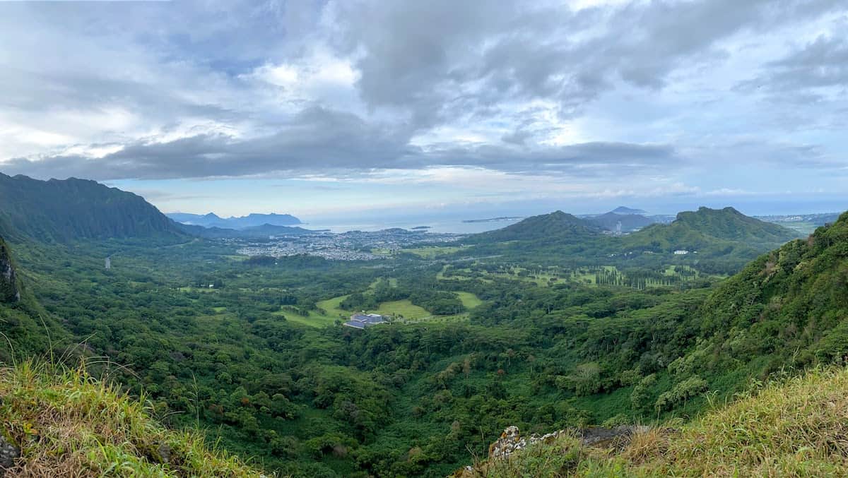 A panoramic shot of the view of the lush, green windward coast from Nu'anu Pali Lookout.